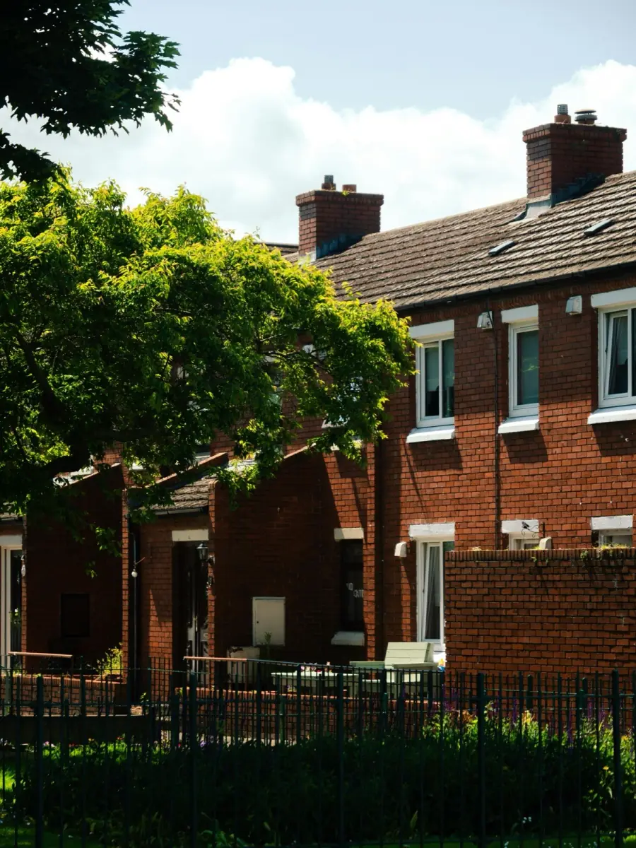 A row of brick homes on a sunny street, a new neighborhood to call home